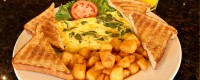 ontario restaurants serving brealfast.a spinach omelette with homefies and toast at symposium cafe