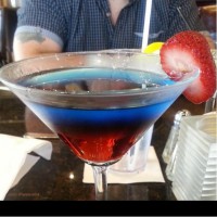 purple haze martini on patio at symposium cafe restaurants