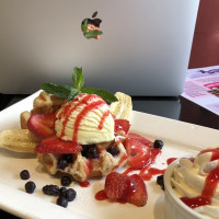 ontario restaurants dessert, a gaufrette, topped with ice cream, fresh banana and strawberry at symposium cafe