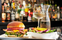 oshawa restaurant lunch place chicken sandwich with a salad and glass wine at symposium cafe