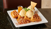 amazing restaurant desserts place caramel apple waffle with ice cream and sauce at symposium cafe