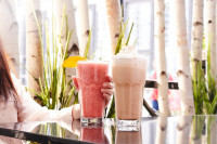 symposium cafe near me serving creamy milkshakes fruit drinks